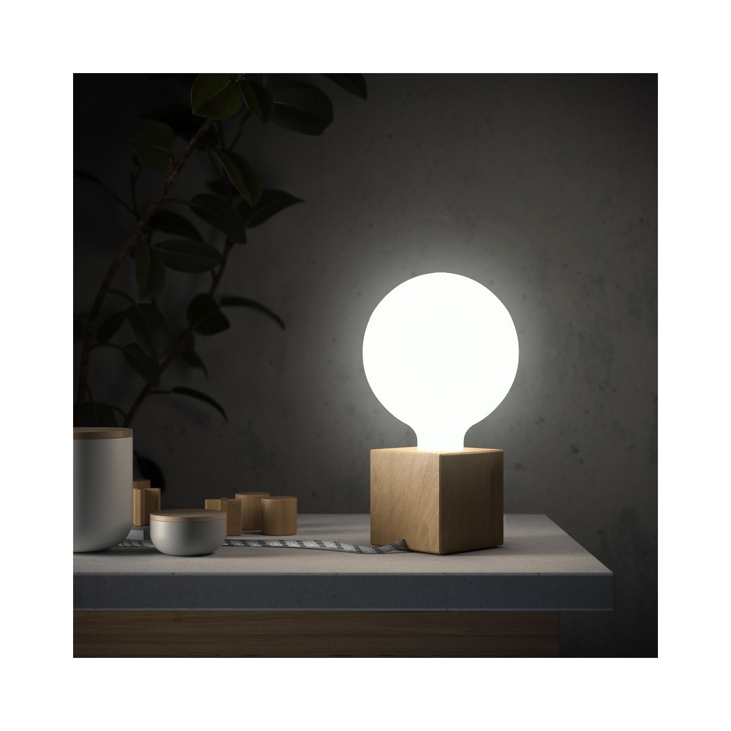 Posaluce Cubetto, our table lamp in wood complete with fabric cable, switch and UK plug