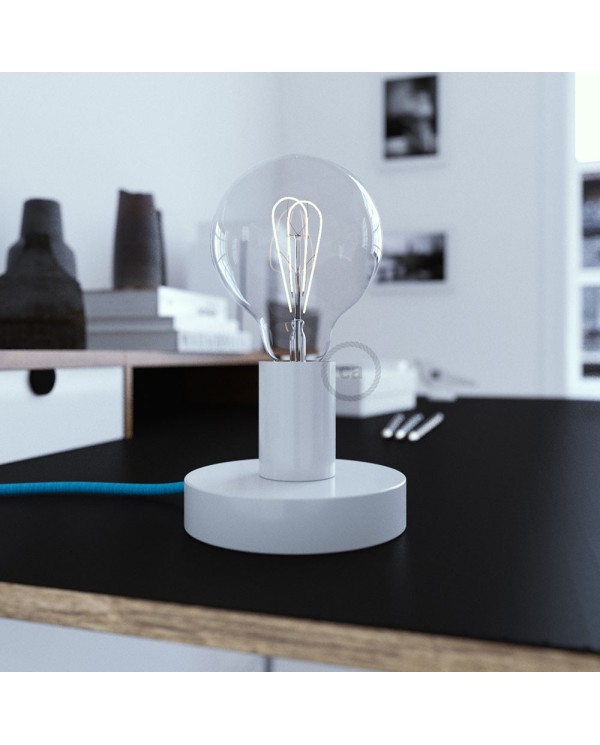 Posaluce, the white metal table lamp, with textile cable, in-line switch and english plug