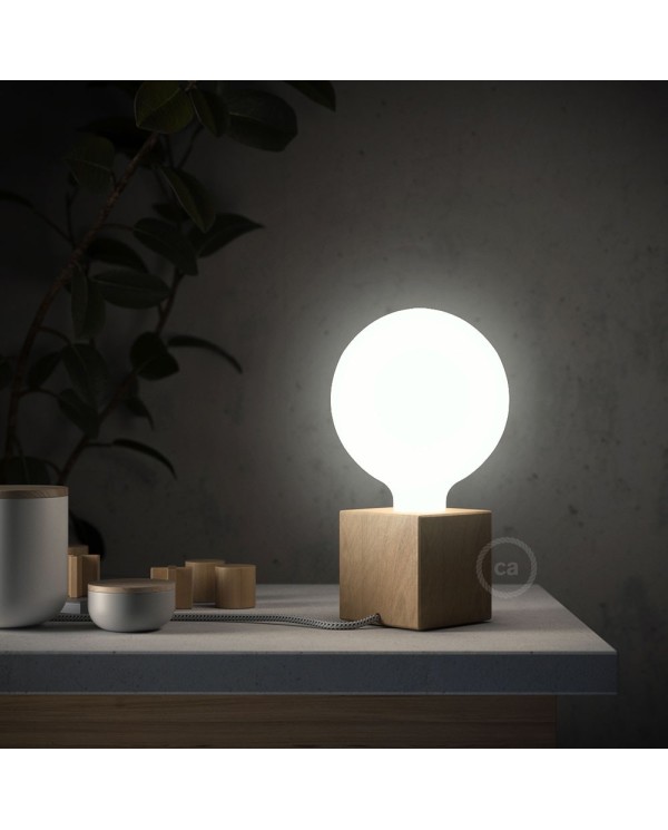 Posaluce Cubetto, the natural wood table lamp, with textile cable, in-line switch and english plug