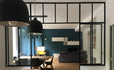 Teal color and customized lights starring in a Turin apartment